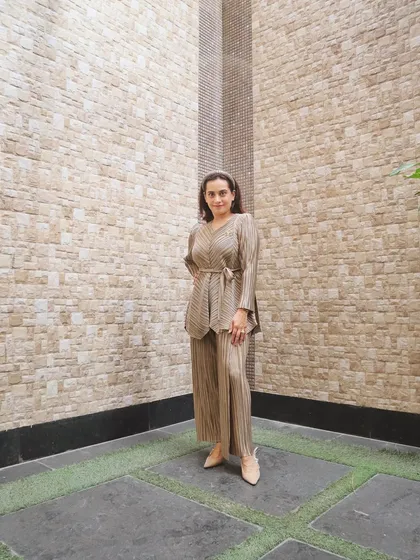 This pleated co-ord set from my own brand, ShopUrStyleCoach, embodies effortless elegance. The fluid silhouette and neutral tone make it a sophisticated choice for a professional setting, proving that comfort and style can go hand in hand.
