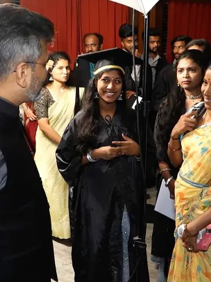A lighthearted moment with a graduate and her mother. The success of a student is a proud moment for the entire family, and it was a joy to share in their happiness.