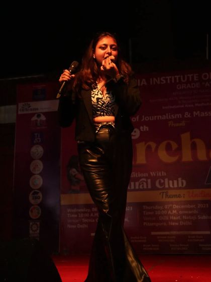 In the zone, commanding the stage with the mic in hand. This is where I feel most alive, guiding the event and interacting with the crowd.
