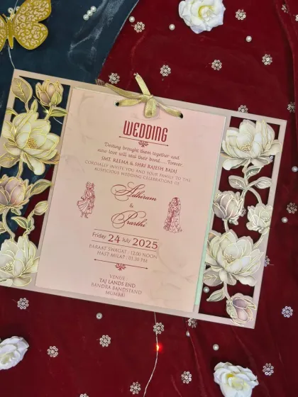 Craftsmanship is in the details. This card features a beautiful laser-cut floral frame, creating a stunning 3D effect that surrounds the main wedding insert. It's a testament to how modern techniques can elevate traditional design.
