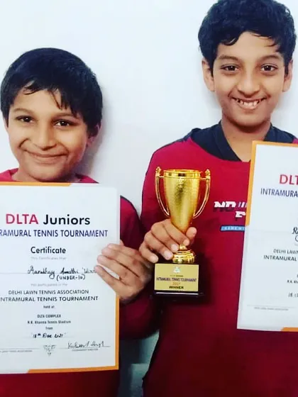 Brothers Aaradhy and Rudran Awasthi with their trophies after winning the DLTA juniors tournament in the Under-10 and Under-12 categories, respectively. A proud moment for them and the academy.
