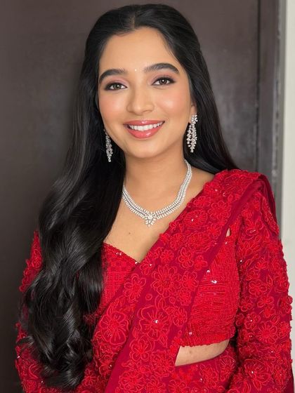 A beautiful portrait capturing her bright and happy energy. The makeup is kept fresh and luminous to let her personality shine.