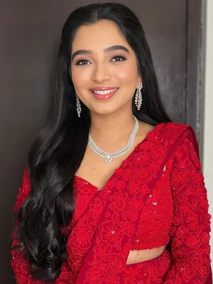 A beautiful portrait capturing her bright and happy energy. The makeup is kept fresh and luminous to let her personality shine.