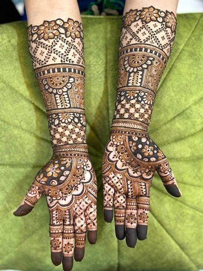 A beautiful design with delicate floral patterns on the arms and a mix of bold and fine lines on the hands.