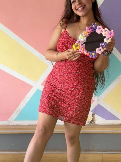 She's all smiles with her new handmade clay mirror. A perfect accessory and a great memory.