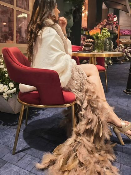 The trail of my feathered gown created such a beautiful, dramatic effect. It's all about making an entrance and leaving a lasting impression.