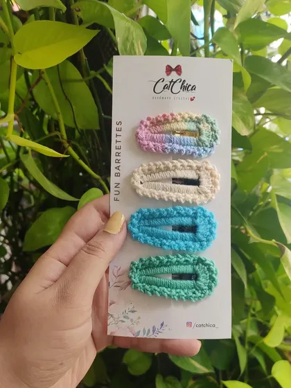 A smaller set of four 'Fun Barrettes' in pastel rainbow, cream, aqua, and sea green. Perfect for a cool-toned color palette.