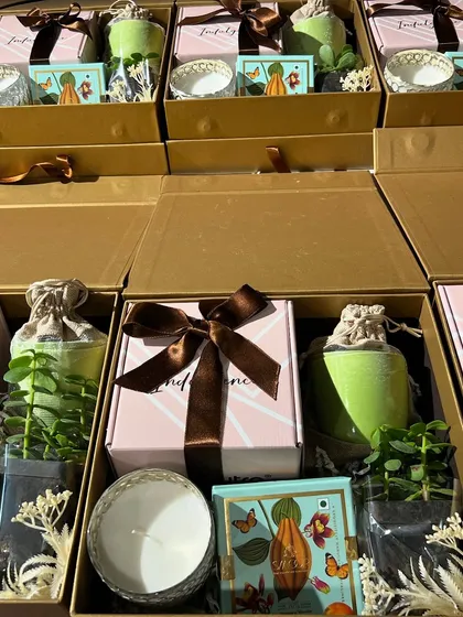 Another angle of our wellness-themed corporate gifts. The combination of natural elements like the plant with luxury items like the candle and chocolates makes for a thoughtful and impressive present.