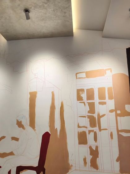 A work-in-progress shot of the same Bandra mural, where the initial color blocking has begun. This image shows how I build layers of acrylic paint to develop the scene's depth and atmosphere.