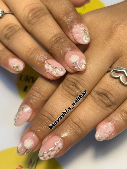 Soft and elegant, this set features delicate white flowers painted over a blush pink base. I added silver accents and a touch of glitter to create a dreamy, romantic look.