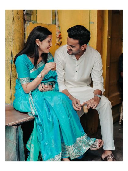 Sharing a cup of chai, this candid photo captures a simple, authentic moment of connection amidst the old-world charm of Mumbai.