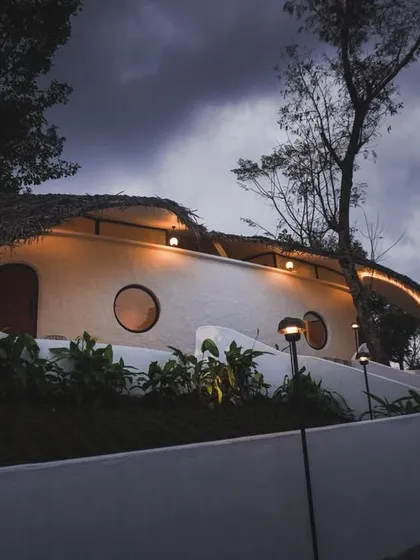 We champion innovation in sustainable design. This eco-retreat by Raving Dots Studio merges parametric modeling with vernacular techniques, resulting in a ferrocement shell that grows from the land with minimal environmental impact.