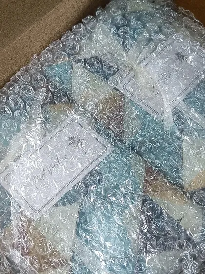 Custom passport covers ready to be shipped. This image shows the minimalist and secure packaging we use to ensure your gifts arrive in perfect condition.