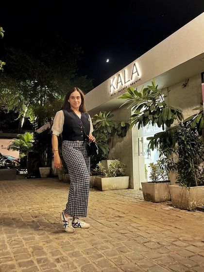 Layering is a key skill for any stylish professional, especially during transitional seasons. This look shows how a simple vest can add structure and sophistication to an outfit for a dinner or a smart-casual event.