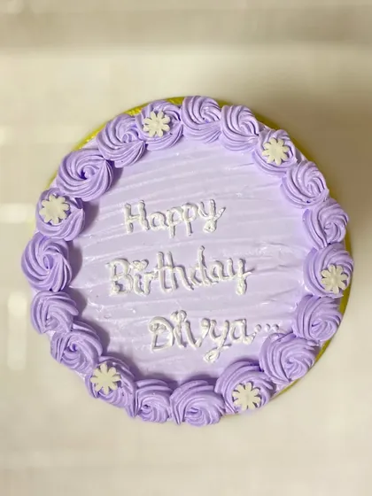 Rosettes and everything right. A simple yet beautiful butterscotch cake with lavender rosettes.