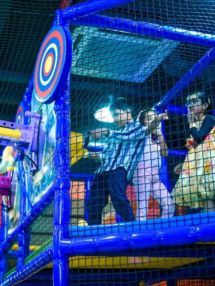 Kids aiming for the target with our air-powered soft ball cannons. This interactive game is a highlight of the My Maze area.