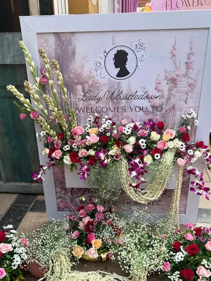We combined regal elegance with heartfelt tradition for this Bridgerton-themed Godh Bharai. This custom welcome sign, adorned with lush, cascading florals, set a luxurious and personal tone for the event, greeting guests with the charm of the Regency era.