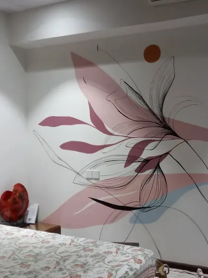 A closer look at the boho mural, showing how the abstract pink shapes and delicate black line art interact. It's a balance of boldness and subtlety.