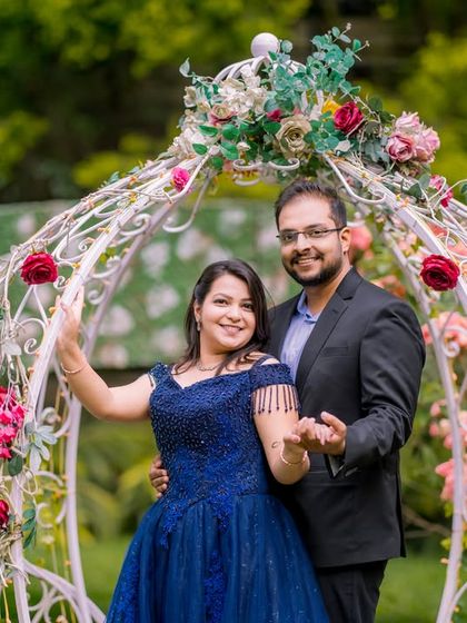 A classic portrait by the Cinderella carriage, surrounded by beautiful flowers.