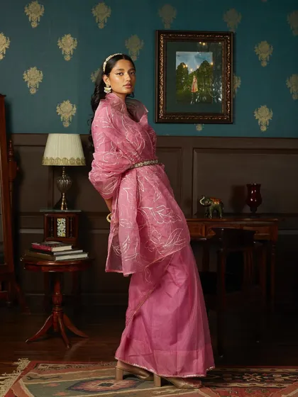 A dynamic pose from the same shoot, showcasing the beautiful drape and flow of the organza sari. My art direction focuses on capturing the movement and life of the fabric.