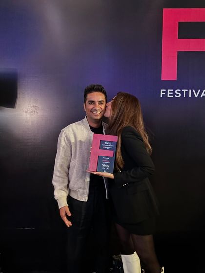 A sweet moment of celebration after receiving the FOAID award. We are a team in every sense of the word, and we celebrate our victories together.