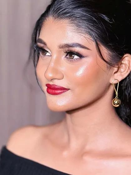 The perfect red lip paired with a sharp, clean winged eyeliner.