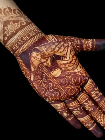 Another example of a beautiful, dark henna stain on a bridal portrait. The details of the bride's pose and outfit are perfectly preserved in the color.