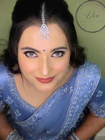 A captivating portrait of my client, ready for her reception. Her bright eyes, flawless skin, and elegant updo create a look of pure sophistication.