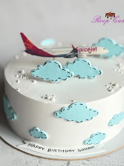 A simple travel-themed cake perfect for a smaller celebration. This half-kg cake features a SpiceJet airplane flying among fluffy fondant clouds.