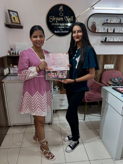 Another happy student ready for her future in the nail industry after completing our comprehensive training program.