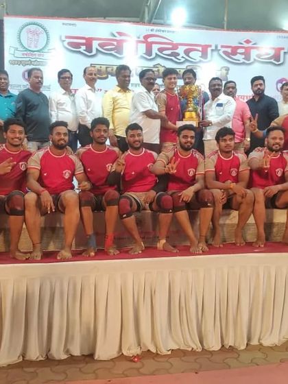 Posing with the runners-up trophy, our players show pride in their performance.