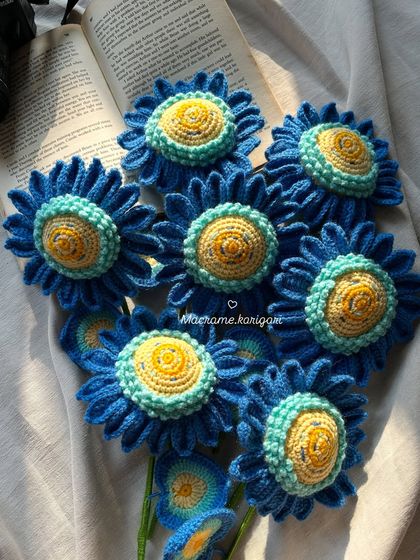 A close-up shot of the intricate, multi-toned centers of our blue crochet sunflowers, designed to mimic the brushstrokes of a painting.