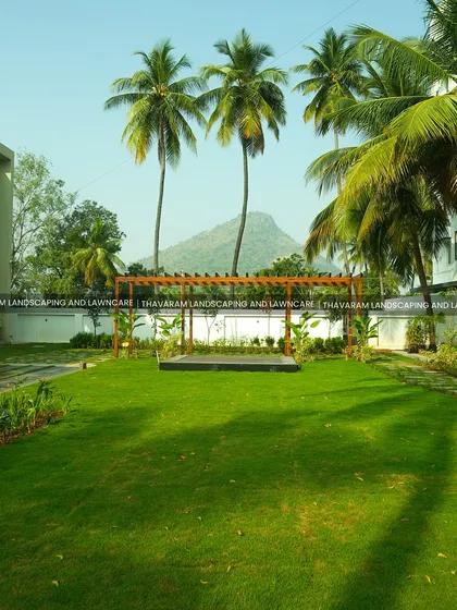 I designed this residential garden to be a true escape, blending a modern wooden pergola and a vast, manicured lawn with the natural beauty of the surrounding hills. This is where architecture and nature meet to create a private paradise.
