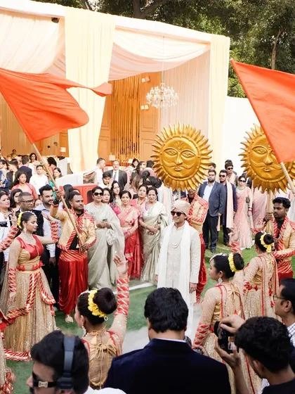 A view from behind the dancers shows the scale of the groom's procession. The entire baraat follows the choreographed entrance, making it an inclusive and spectacular experience for all guests.
