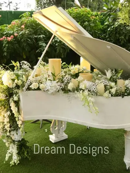 It's the unique details that tell your story. I transformed this grand piano into a stunning floral installation, overflowing with white blooms and candles, creating a memorable and artistic focal point for the event.