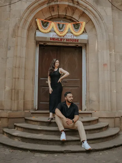 A chic and stylish portrait on the steps of a heritage building. This shot from their Mumbai pre-wedding session has a cool, editorial feel.