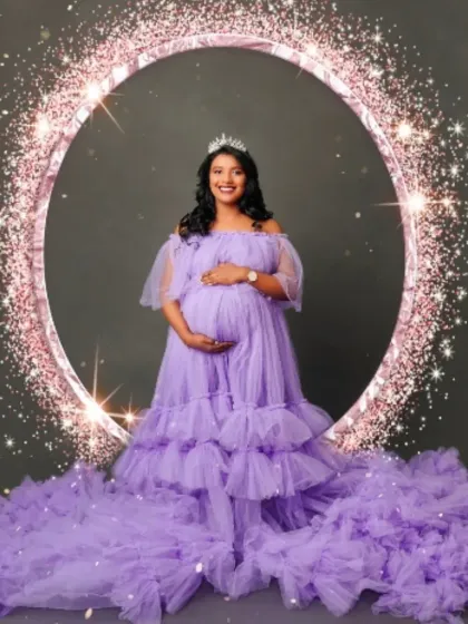 Your coronation moment. This mom-to-be shines in our lavender tulle gown, complete with a sparkling tiara, proving every mother is a queen.