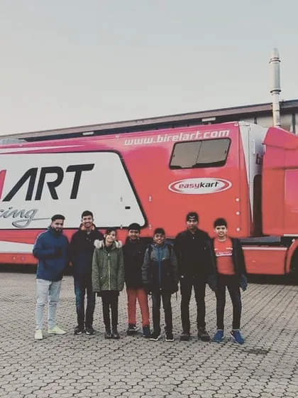 A group photo in front of the Birel ART racing hauler, marking the end of a successful winter testing trip to Italy.