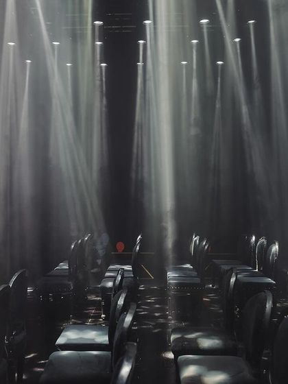 A view of the guest seating from the stage, showing the powerful effect of the 92 sharpie lights creating beams through the haze.