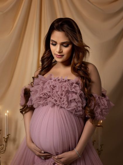 A close-up that highlights her beautiful makeup and the intricate details of the gown's bodice.