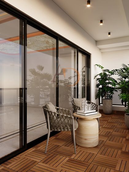 The full-height sliding glass doors seamlessly blend the indoor living area with this charming outdoor balcony retreat.