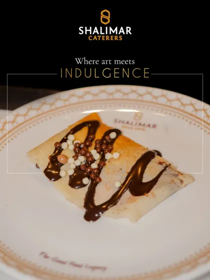 Where art meets indulgence. This beautifully folded crepe is drizzled with chocolate and topped with crunchy pearls, a true work of art.