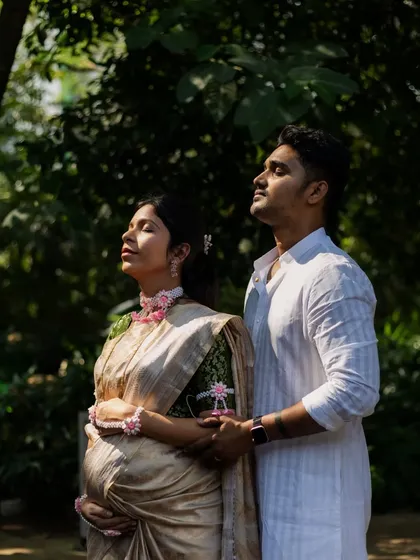 A serene, artistic shot of the couple with their eyes closed, soaking in the moment together during their maternity photoshoot.