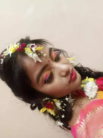A detailed shot of the eye makeup for the Haldi look. The student has skillfully blended warm sunset colors on the eyelid, a technique we teach in our advanced makeup classes.
