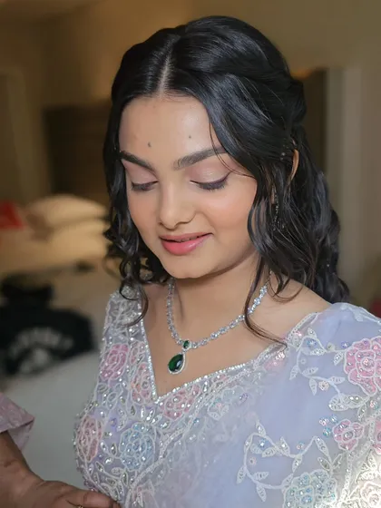 A candid moment showing the soft, ethereal quality of the makeup and hairstyle.