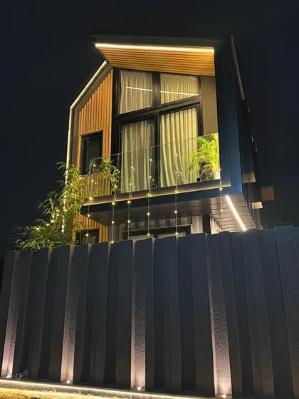 A look at a completed shipping container home at night. This project demonstrates how I transform industrial materials into warm, inviting, and sustainable living spaces with thoughtful lighting and design.