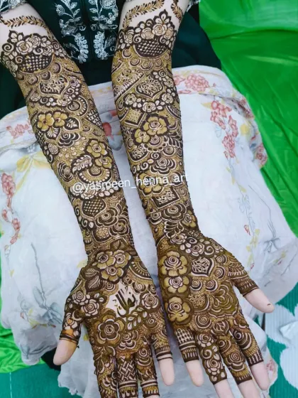 Alfiya's bridal mehndi, where her name is subtly woven into the intricate pattern on her palm.