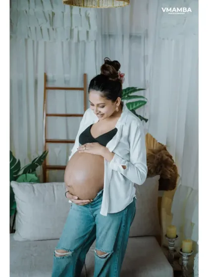 A gentle, smiling portrait of an expecting mother. My studio is designed to be a comfortable and relaxing space, which helps in capturing these serene moments.