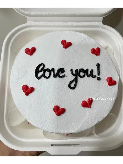 A slightly different style of the 'love you!' message, written in a beautiful black script surrounded by little red hearts.