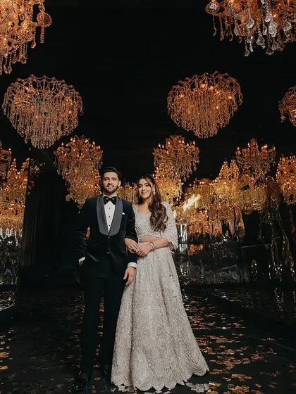 The stunning setup for Ashmeet and Anmol's cocktail night. This image highlights the glamour and scale of their celebration, captured with a cinematic eye. We ensure that the beautiful ambiance you create becomes a key character in your wedding story.